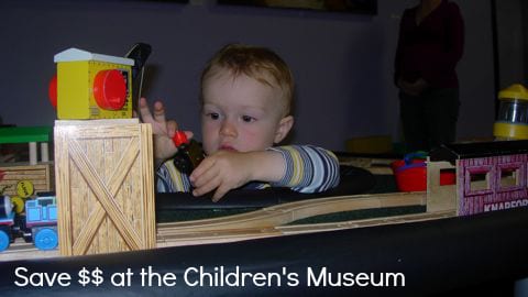 Train table and toddler at the children's museum