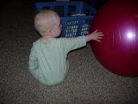 Holden is fascinated by huge red ball